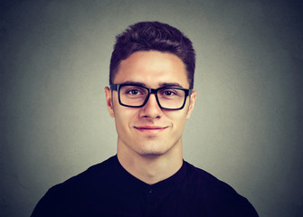 Smiling attractive man in glasses with a modern hairstyle
