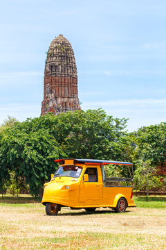 Tuk Tuk car tourist at parking outdoors with Wat Mahathat background, Ayutthaya Province, Thailand