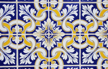 abstract tile pattern in blue, yellow and white