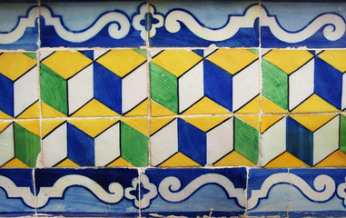 Blue, yellow and green Portuguese tiles (azulejos) with geometric pattern