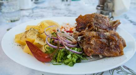 Baked Goat With Potatoes