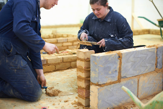 Student learning how to do building work