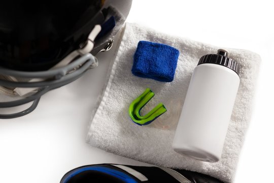 High angle view of wristband and bottle on napkin