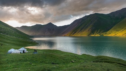 Sunset over yurt and mountain in Kyrgyzstan - obrazy, fototapety, plakaty