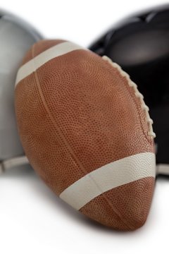 Close up of American football by sports helmet