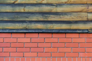 Red brickwork and wooden planks on top (texture, background)