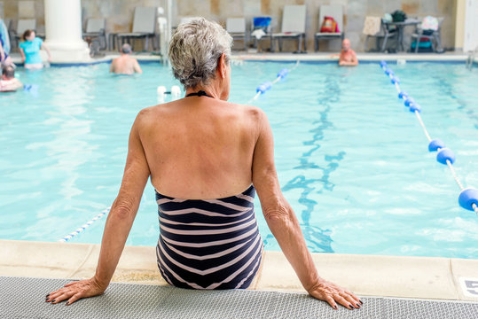 Senior woman by poolside