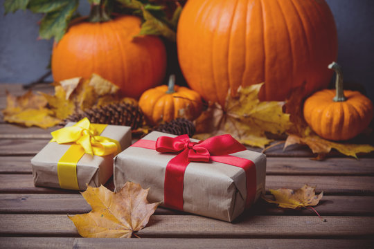 leaves and pumpkin with Halloween gift box