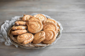 Baked sesame pastry served on the metal plate