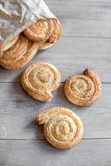 Baked pastry with sesame served on the wooden table
