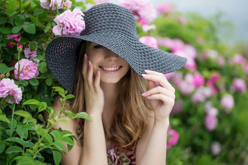 Beautiful woman in roses 