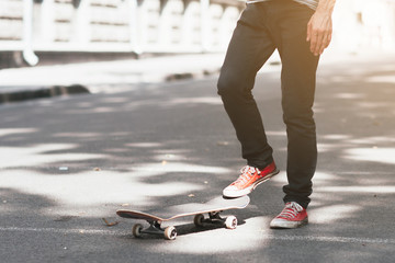 Unrecognizable hipster man with skateboard. First step in skateboarding sport challenge, ready to...
