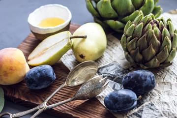 Still life of food. On the table are fruit and spoon.