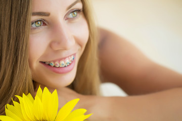 A woman is wearing braces 
