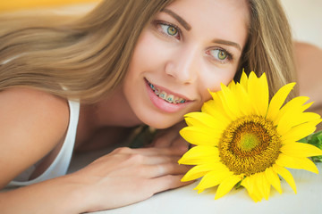 A woman is wearing braces 
