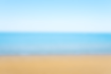 Fototapeta na wymiar sea sand and blue sky blurred for background