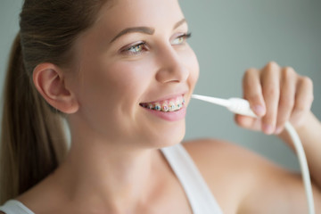 Woman brushing her teeth 