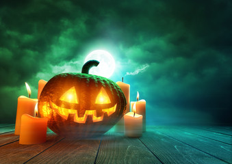 A glowing Pumpkin Jack-O-Lantern lit by an eerie green moonlight on Halloween, mixed media...