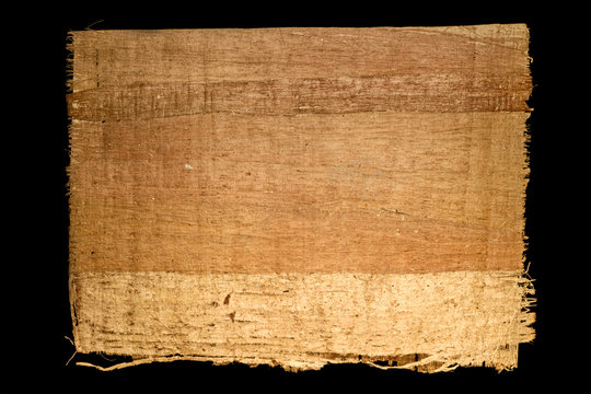 Old sheet of simple papyrus from Egypt isolated on a black background