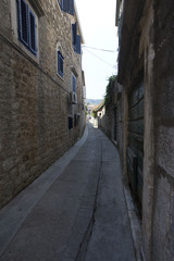 Fototapeta na wymiar Narrow empty street of medieval town