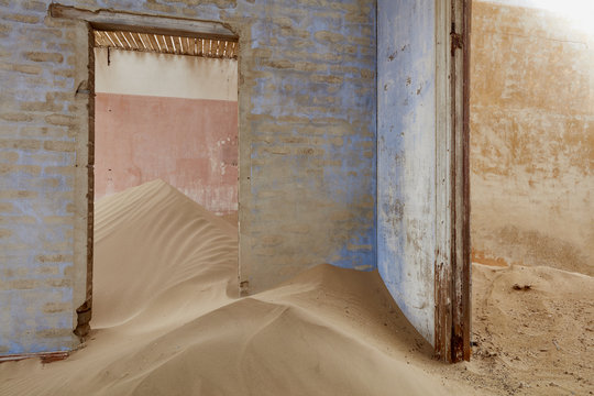 Interior of abandoned building full of sand