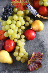 Background: autumn fruits in wicker basket