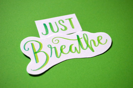 BREATHE hand-lettered on green background