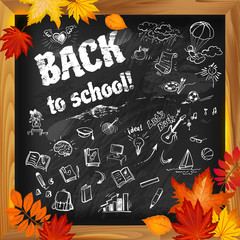 back to school background on dark blackboard witn doodles and autumn leaves