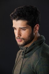 Obraz premium Man standing against black background