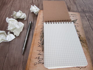 Notepad and pen on the wooden floor,memory,remember,take notes 