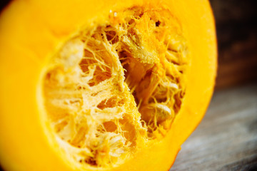 Set of orange pumpkins on wood flat lay free space. Fresh cut squashes on wooden table, country autumn background. Seasonal, harvest, fall, organic food, dieting, healthy food concept