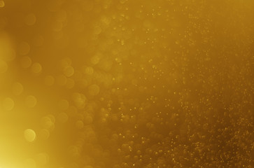 Glitter light abstract gold bokeh christmas blurred background