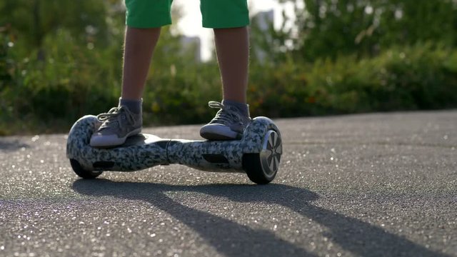 Boy spining on gyroboard or gyroscooter or hoverboard