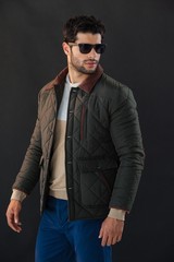 Obraz premium Man posing against black background