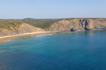 Cliffs, beach and waves in Arrifana