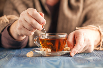 Male hold cup of hot tea