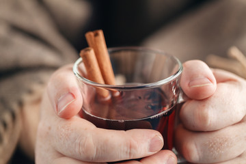 Homemade hot spiced wine in hand, mulled wine