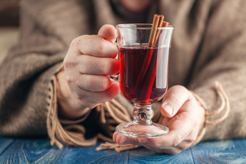 Winter time hot spiced red wine in glass mug