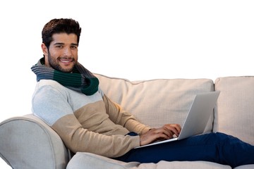 Portrait of smiling man using laptop