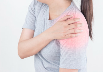 Young woman suffering from pain the shoulder, Health Care Concept.