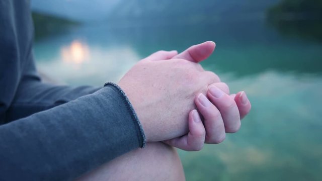 Nervous body language, female hands for anxiety and embarrassment concept, hands comforting each other