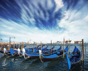 Fototapeta premium Gondolas on Grand canal in Venice, San Giorgio Maggiore church. San Marco. Beautiful summer landscape.