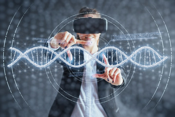 Happy woman on a black background in the studio gets the experience of using VR-glasses virtual reality headset. Innovative technologies in science and medicine.