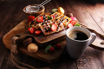 Belgian waffles with strawberries and raspberries, homemade healthy breakfast with coffee