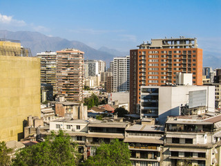 Old residential buldings and Andes mountains in the background in Santiago, Chile