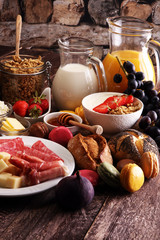 Breakfast served with coffee, orange juice, croissants, cereals