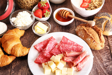 Breakfast served with coffee, orange juice, croissants, cereals and fruits. Balanced diet.