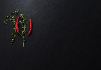 space chopstick with chili and vegetable on dark background

