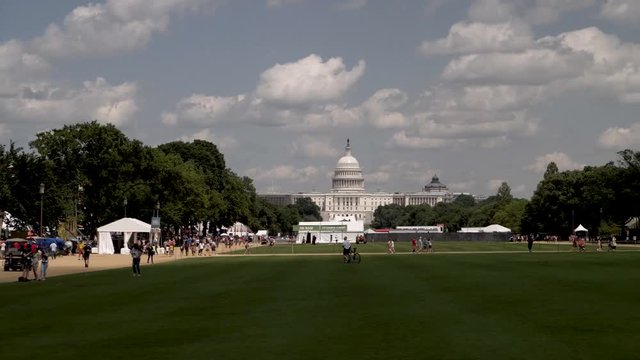 Steadicam shot of the US Capital shot from the National Mall during the Smithsonian Institution&rsquo;s annual Folklife Festival.
