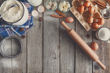 Fototapeta na wymiar Baking ingredients on rustic wood background